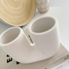 White stoneware glazed U vase - Image 3