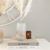 Tall ribbed glass bottle vase