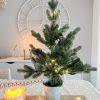 Faux Christmas tree with LED lights in silver pot