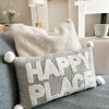 'Happy place' cushion with pom poms