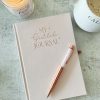A beautiful 'Gratitude' journal with rose quartz pen