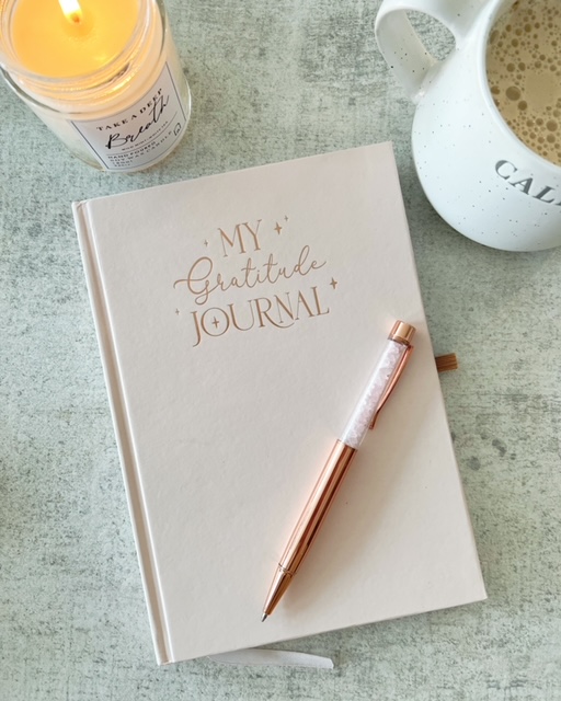 A beautiful 'Gratitude' journal with rose quartz pen
