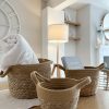 A set of 3 woven baskets with handles