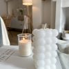 Tall white bubble candle