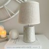 Ceramic table lamp with leaf decoration