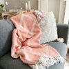 Coral geo throw with tassels