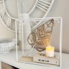 Small white metal shelf with leaf decoration