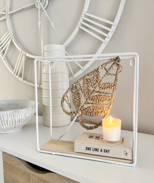 Small white metal shelf with leaf decoration