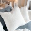 Pair of cream/white soft boucle cushions