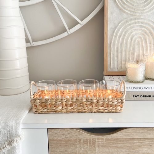 Rattan candle display with glass votives