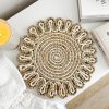 Woven mat with scalloped edge