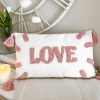 'Love' cushion with tassels