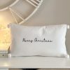White 'Merry Christmas' cushion with pompoms