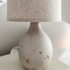 Natural ceramic 'flecked' lamp with linen shade - Image 2